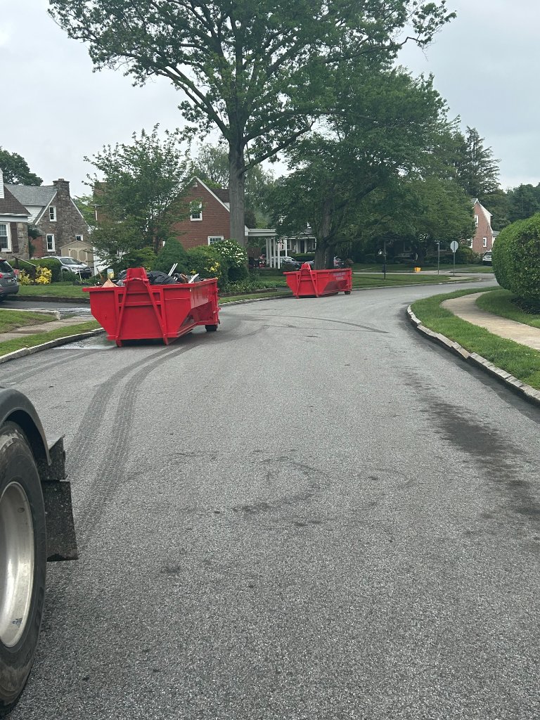 Two Penn Dumpster Rentals dumpsters on a residential street