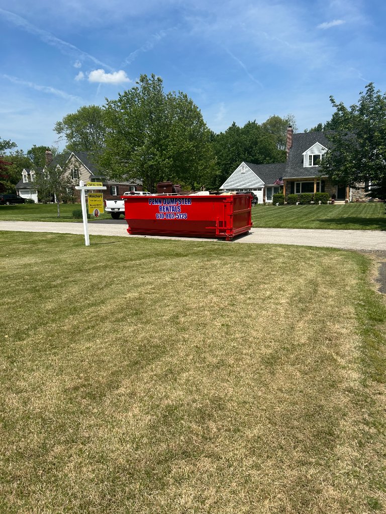 Penn Dumpster Rentals dumpster on a suburban driveway