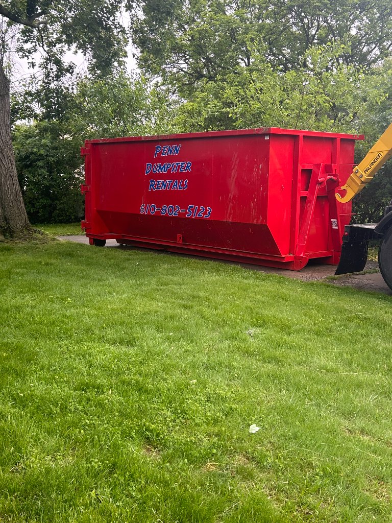 Dumpster on a lawn